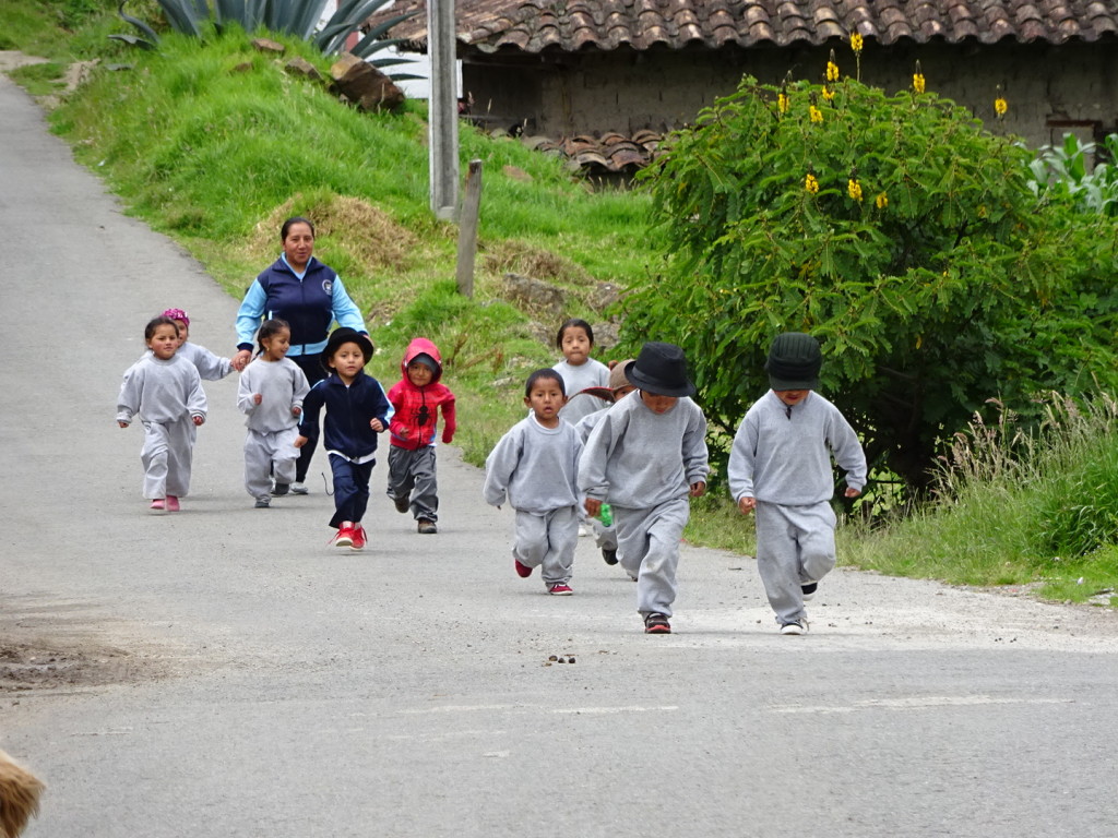 Recess!  These little kiddos were out for a run with their teacher. Love the hats and the spiderman jacket -- old and new together.