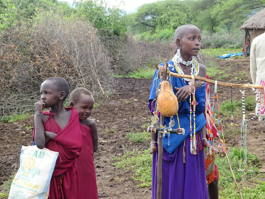 Children selling jewelry and trinkets (men always collect the money)