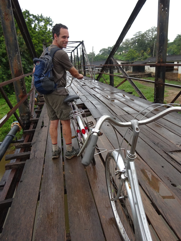 This bridge was awful! In fact, not even safe to bike across. Locals charge a toll in exchange for occassionally nailing down a board.