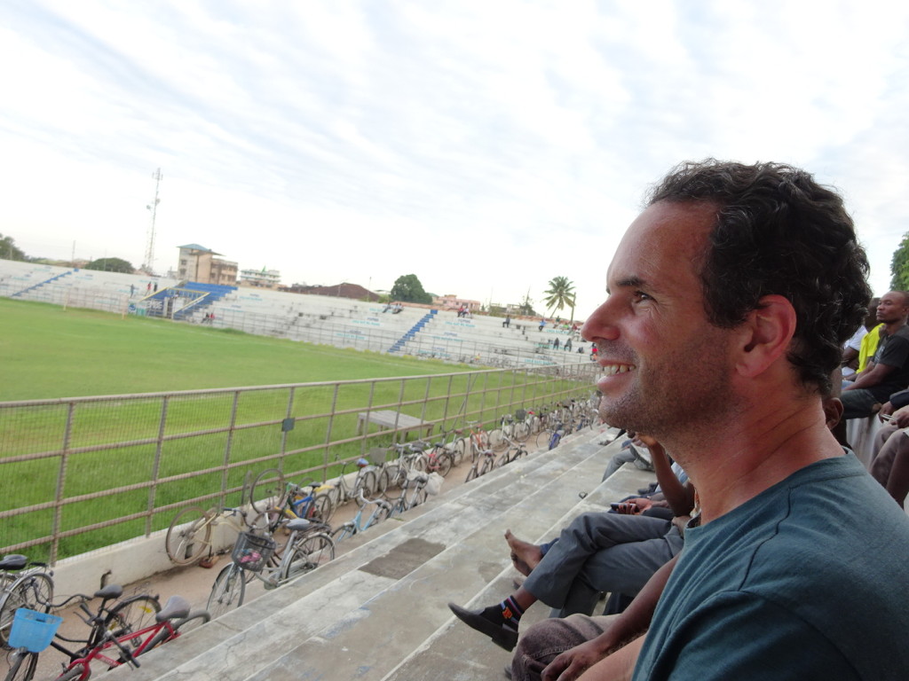 We stopped for a futbal game one afternoon. Along with all other men in Tanga. See the bikes lined us? They ride their bike in and then park it in front of the bleechers. We had a great time.