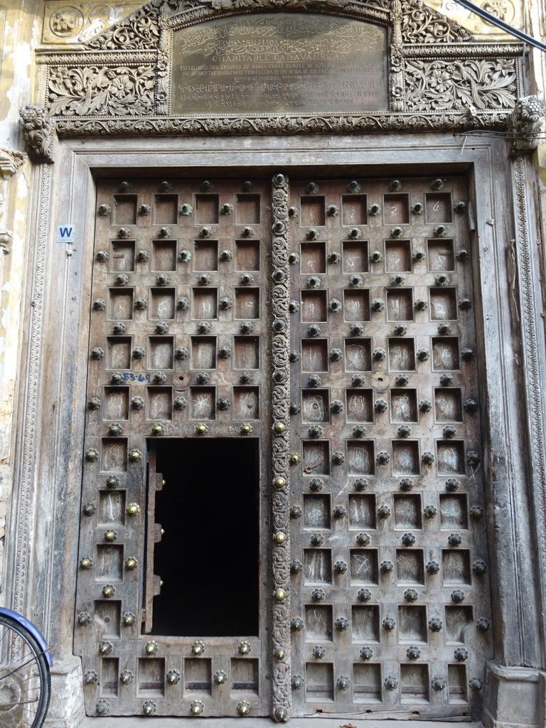 Not common anymore, the inset doors allowed folks to go through without opening the whole door. We saw about 10 folks exit this door...makes you really curious how big the house is behind it!