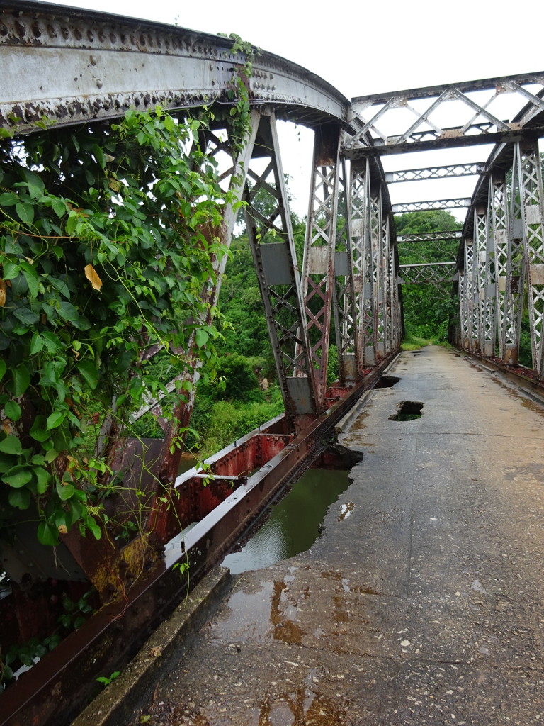 Thankfully this bridge has been replaced because those aren't puddles, those are holes and most of the bolts have been stollen off the bridge. Still, I thought it looked cool. BRIIIIIDGE!