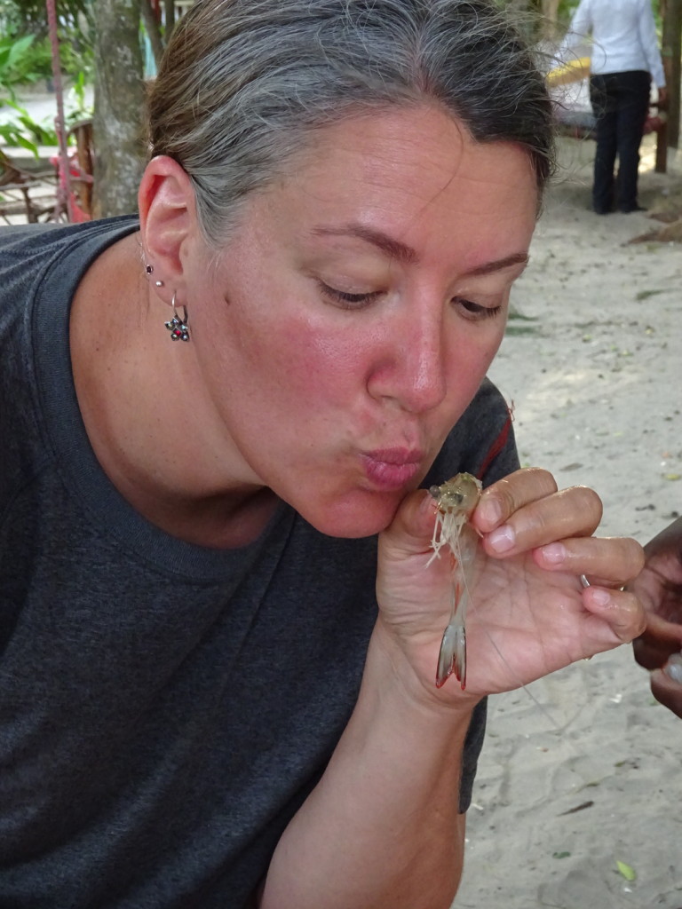 Smooches! We purchased a kilo of river prawns and then David had a villager cook them up for us. We took their heads off and deveined them before handing them over. David says he grew up eating them heads and all!