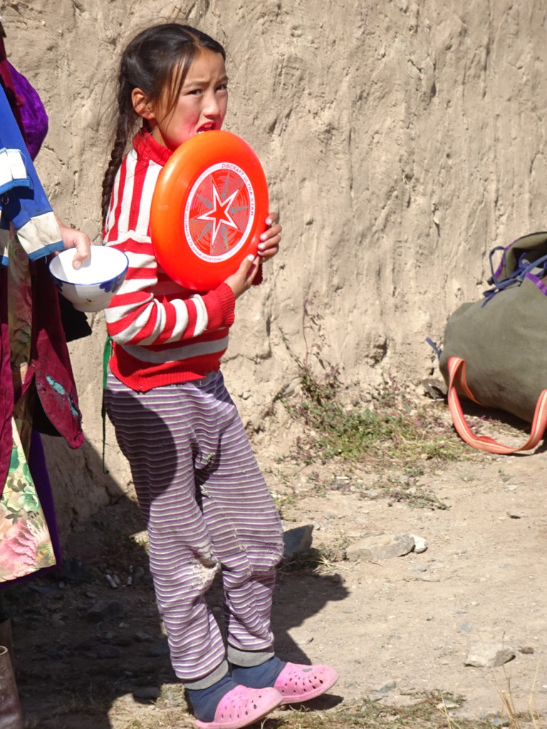 She wouldn't play on the first day, but once Aaron gave the disc to Inkarbek, we did see her trying it out with her littler sisters.