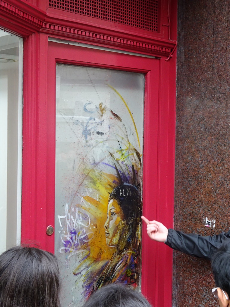 This painting was done on the main window of a barbershop. The owner decided he couldn't keep it there as it blocked the view, so he had the glass removed and put into the door where it remains today! Truly wonderful when a community accepts and artist!