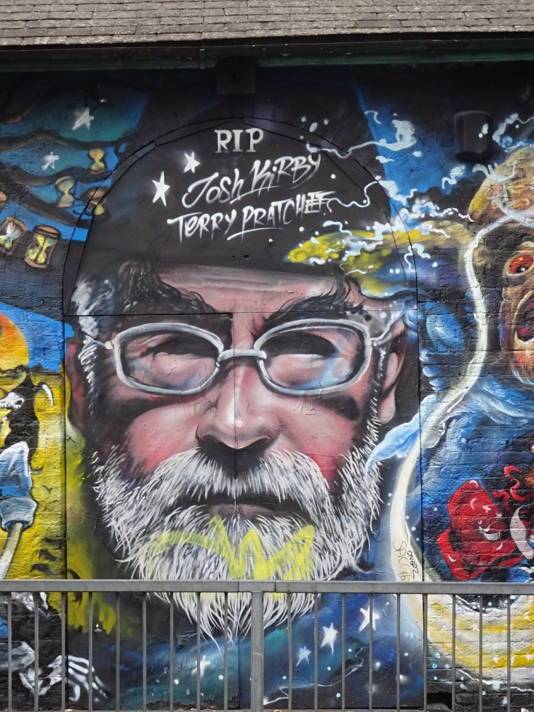 This was just one small part of a blocks-long mural, but I had actually been reading a Terry Pratchett novel at the time, so I had to take the shot.