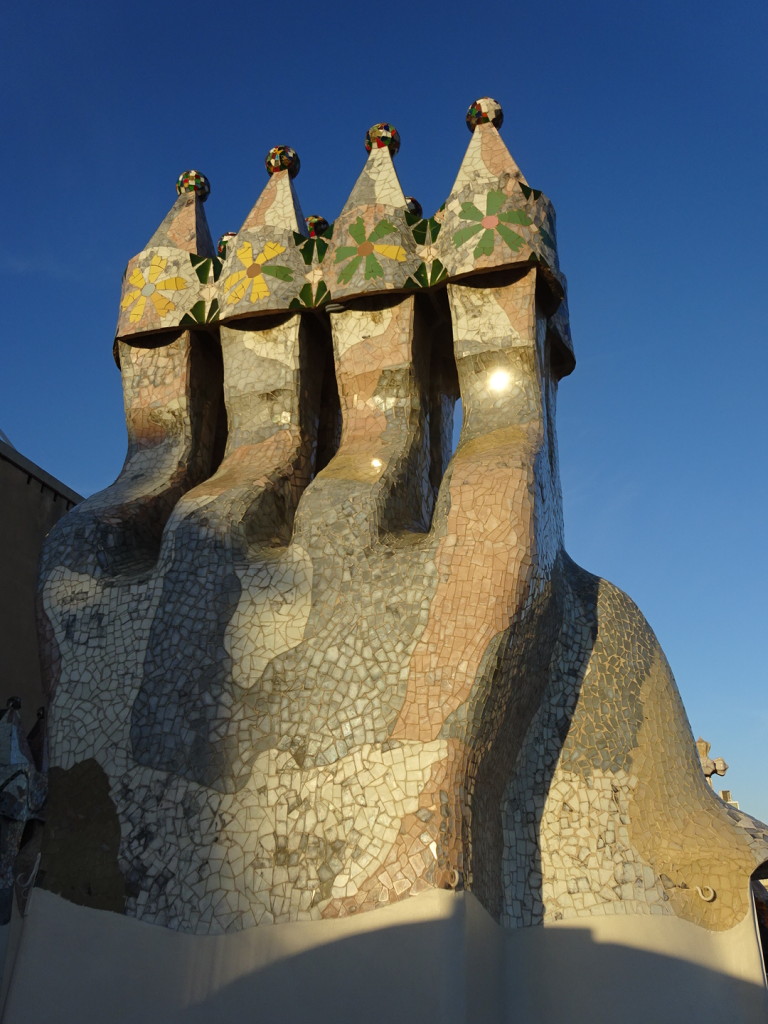 These are all chimineys lined up and decorated. Normally chimineys were an after thought and just popped through the roof where ever they landed. Gaudi went to gread pains to specifically locate everything detail of the house.