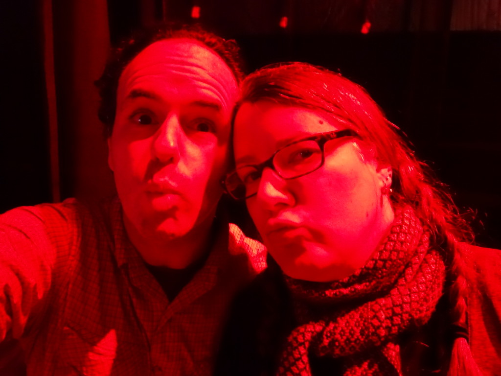 Making duck faces in the red lights.