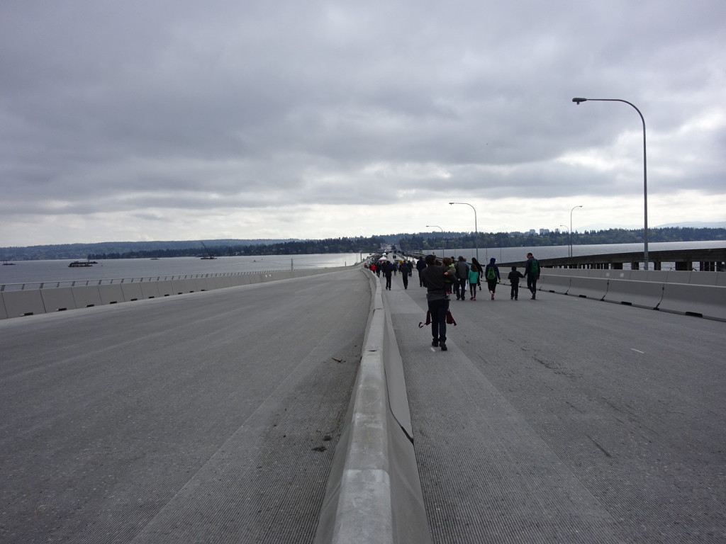 Our first steps on the new bridge! Check out the grooves on the pavement. Those shed the stormwater into the special conveyance system that wooshes the water away for special treatment.