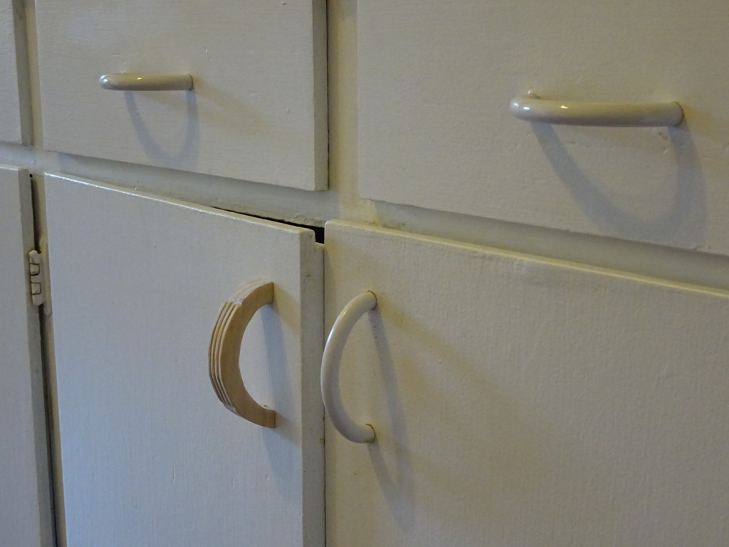 Perhaps a little nicer than our cheap, plastic handles...even if it doesn't match the white very well?