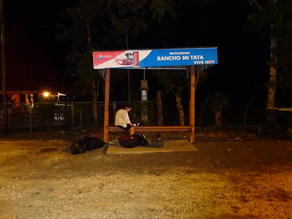 Well into the small hours - Anner waits at the side of the road for the Tica Bus (and blogs).
