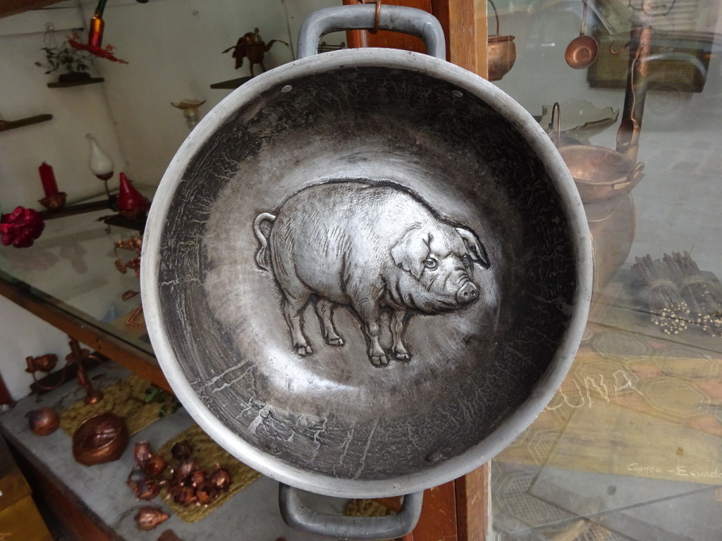 Chased pig on a serving/cooking pot.