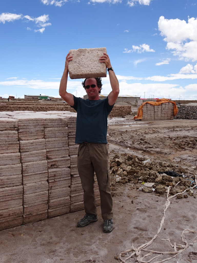 Aaron holding a very heavy block of salt. Used like bricks to build structures and homes in the area.