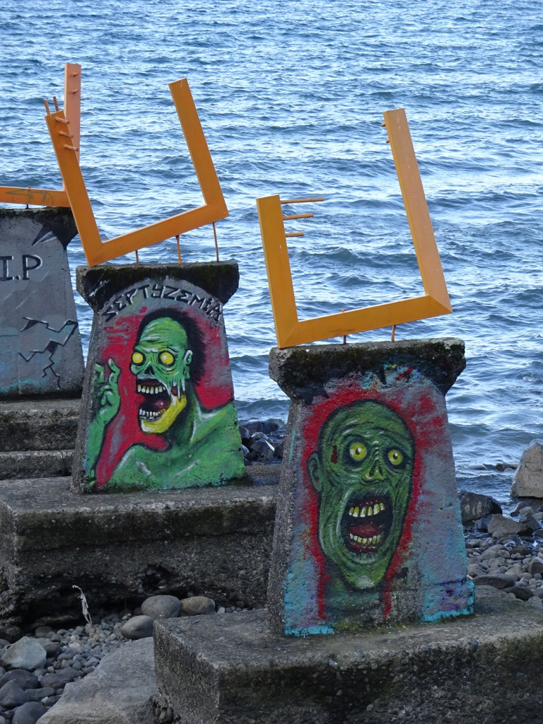 Then, across the street, there were these fellows painted onto the remains of an old pier. Their expressions have nothing to do with their opinions of the exhibition, I'm sure.