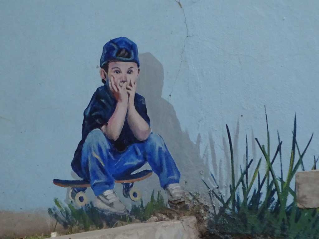 Detail of Martin Ron's mural - this boy came by to watch while Martin was painting, so he just added the boy in! Those are the kind of stories we heard on the tour that we would never have known on our own!