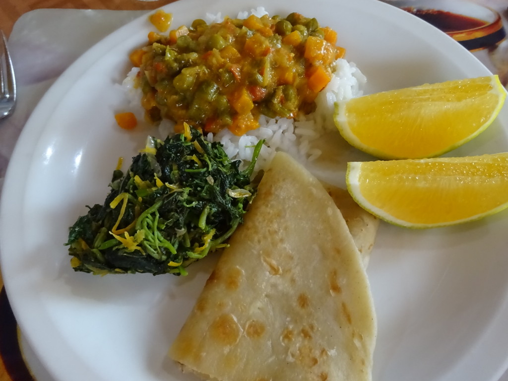 Lunch Time! Veggie curry, rice, greens, chipati and oranges.