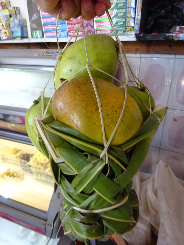 Mangos in a cool, handmade basket.