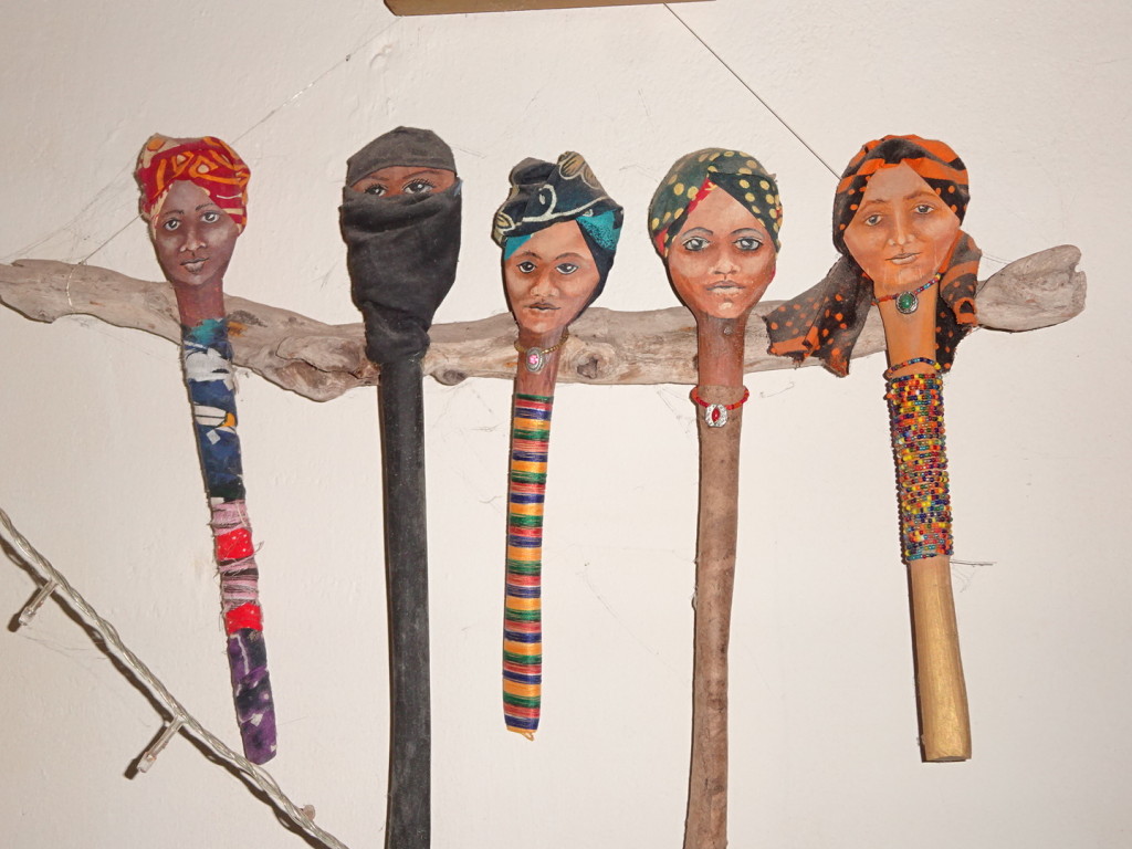 Wooden spoons turned art dolls. They represent the women of Zanzibar.