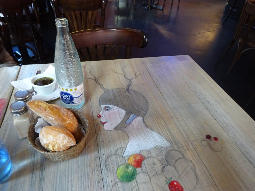 Love to see restaurants getting in on the urban art scene - wonderful tables!