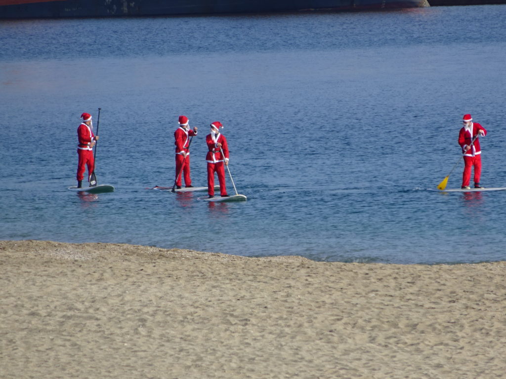 We saw the paddle boarding santas. Hola Santa!
